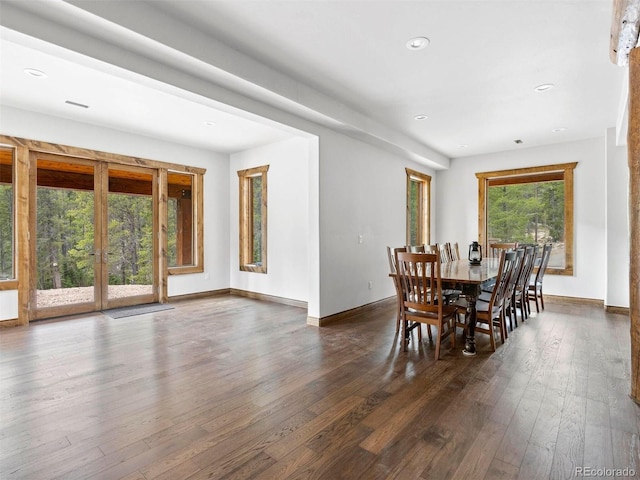 dining space with dark hardwood / wood-style flooring and french doors