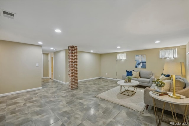 living room featuring recessed lighting, visible vents, decorative columns, and baseboards