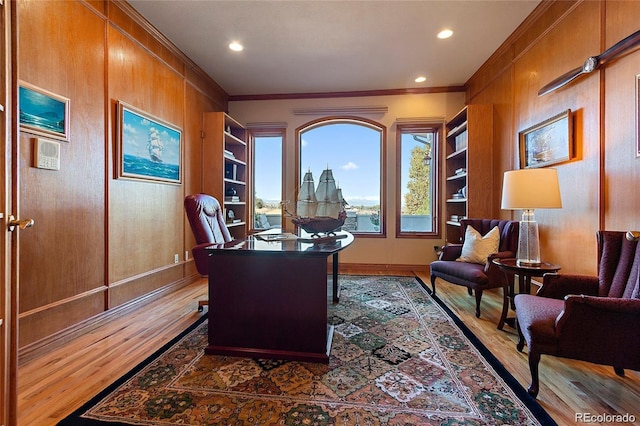 11541 Warrington Ct, Parker, CO 80138 - office area featuring wood finished floors, ornamental molding, built in features, recessed lighting, and baseboards