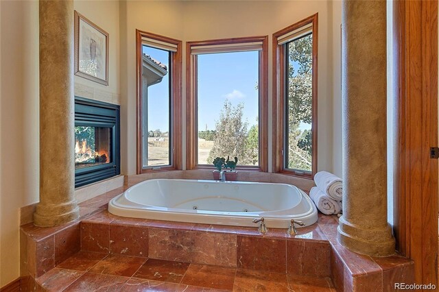 11541 Warrington Ct, Parker, CO 80138 - bathroom with a tiled fireplace and a whirlpool tub
