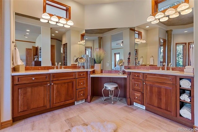 11541 Warrington Ct, Parker, CO 80138 - full bathroom with plenty of natural light, two vanities, a towering ceiling, and recessed lighting