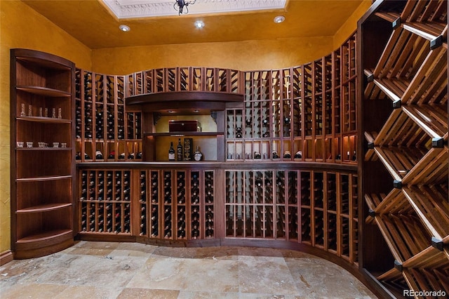 11541 Warrington Ct, Parker, CO 80138 - wine area featuring stone finish floors and recessed lighting