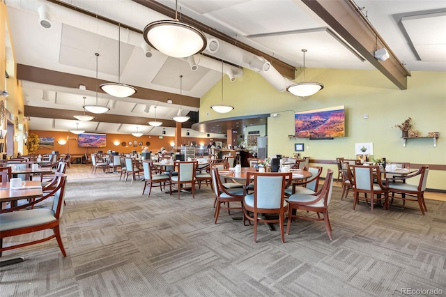 3022 S Wheeling Way Unit 109, Aurora, CO 80014 - carpeted dining space featuring high vaulted ceiling and beamed ceiling