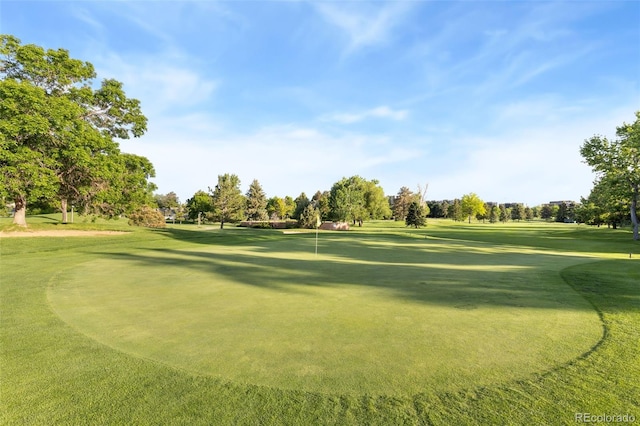 3022 S Wheeling Way Unit 109, Aurora, CO 80014 - view of property's community featuring a putting green, golf course view, and view of scattered trees