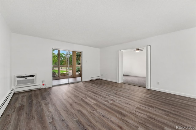 3022 S Wheeling Way Unit 109, Aurora, CO 80014 - unfurnished room with a baseboard radiator, wood finished floors, an AC wall unit, and baseboards