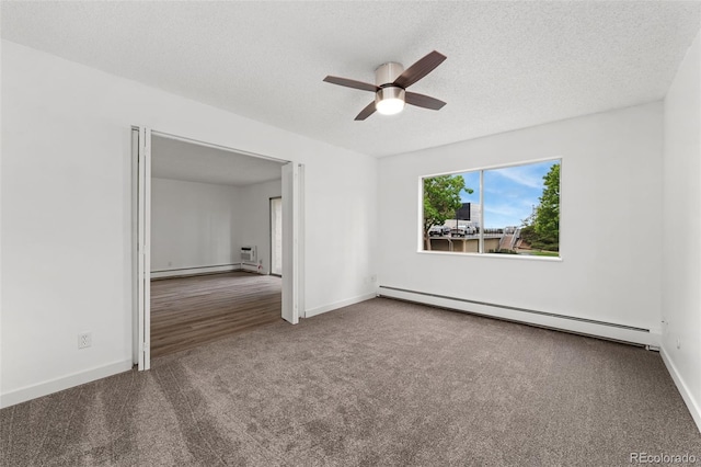 3022 S Wheeling Way Unit 109, Aurora, CO 80014 - empty room featuring a baseboard radiator, carpet, ceiling fan, baseboards, and a textured ceiling