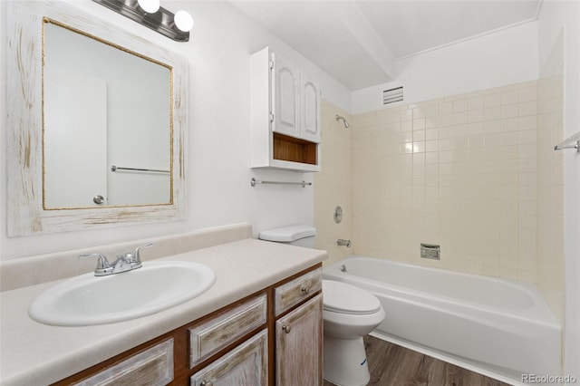 3022 S Wheeling Way Unit 109, Aurora, CO 80014 - full bath featuring toilet, vanity, wood finished floors, and tub / shower combination
