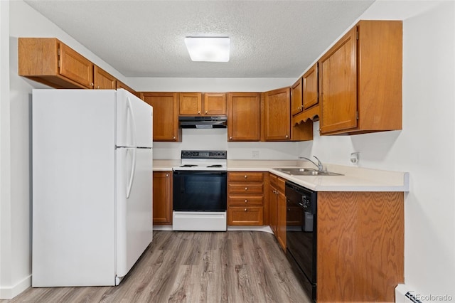 3022 S Wheeling Way Unit 109, Aurora, CO 80014 - kitchen featuring freestanding refrigerator, electric range oven, a sink, under cabinet range hood, and black dishwasher