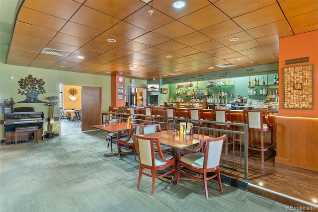3022 S Wheeling Way Unit 109, Aurora, CO 80014 - dining area with carpet and a bar