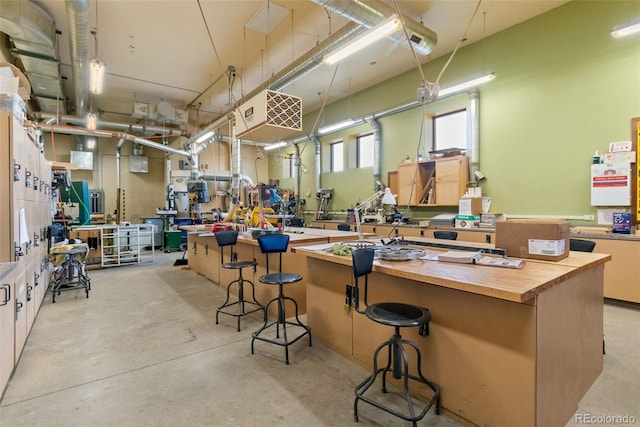 3022 S Wheeling Way Unit 109, Aurora, CO 80014 - miscellaneous room featuring a workshop area and concrete flooring