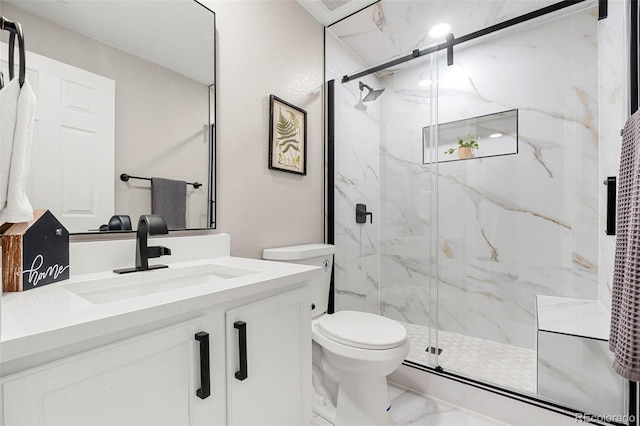 bathroom with vanity, toilet, and walk in shower