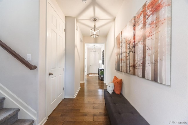 hallway with dark hardwood / wood-style flooring