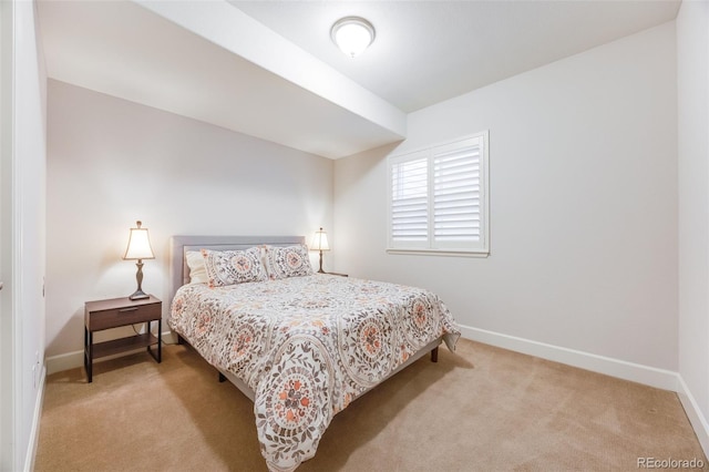 bedroom featuring light carpet