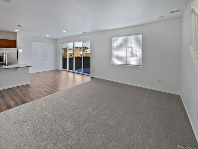 unfurnished living room with carpet