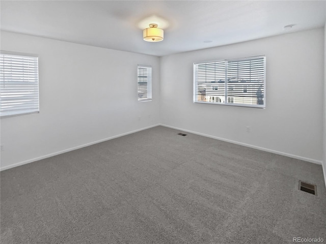 unfurnished room with carpet flooring