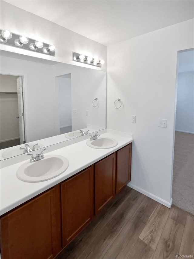 bathroom with vanity and hardwood / wood-style floors