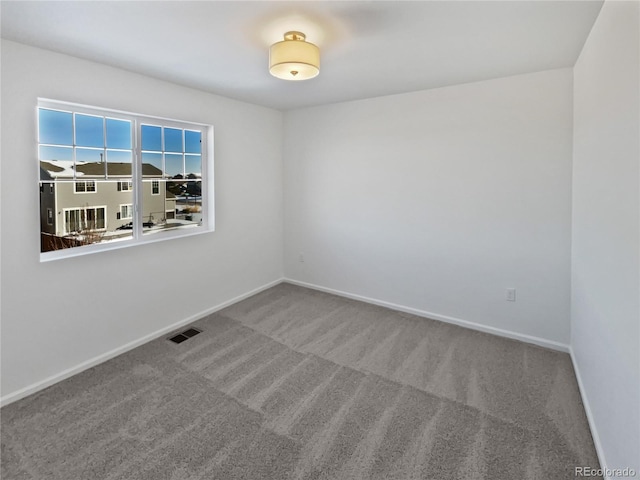 unfurnished room with carpet floors