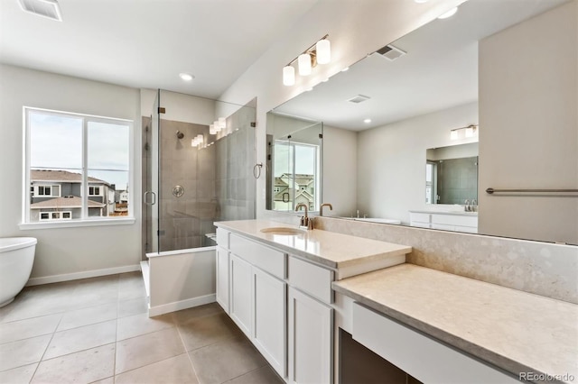 bathroom featuring a shower stall, baseboards, visible vents, and tile patterned floors