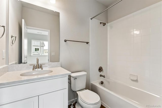 bathroom featuring vanity, toilet, and shower / washtub combination