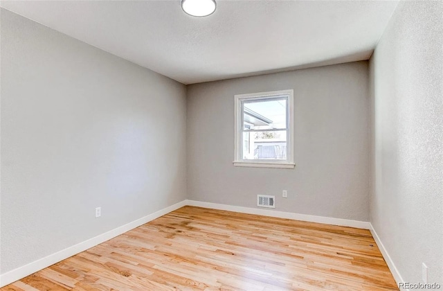 784 S 3rd Ave, Brighton, CO 80601 - spare room featuring wood finished floors and baseboards