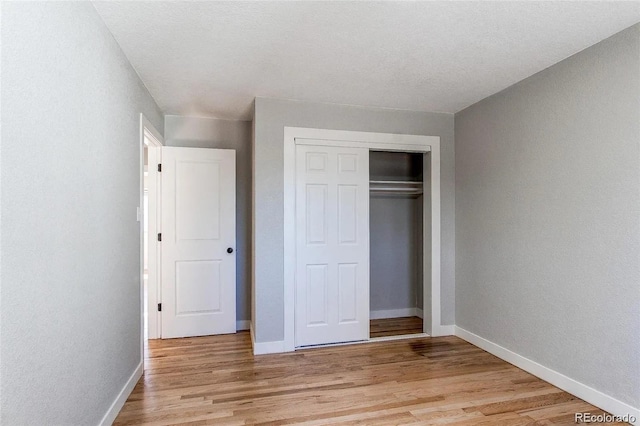 784 S 3rd Ave, Brighton, CO 80601 - unfurnished bedroom with light wood finished floors, baseboards, and a closet