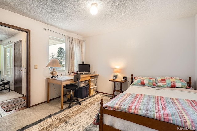 carpeted bedroom with a textured ceiling