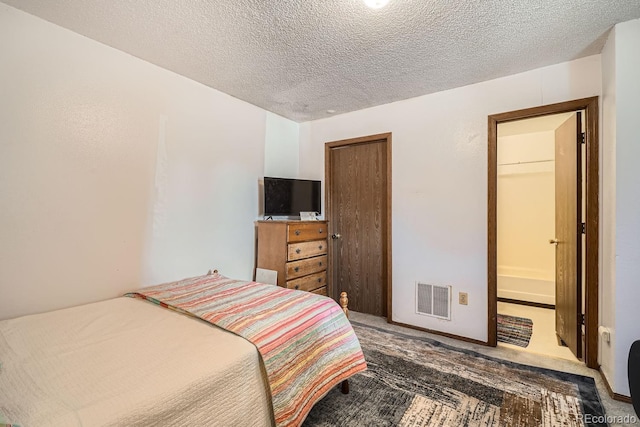 carpeted bedroom featuring a closet and a textured ceiling