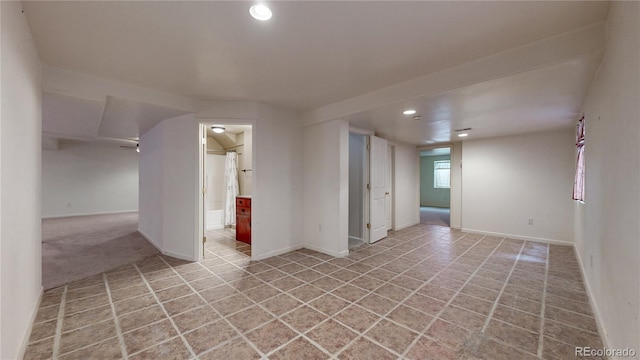 unfurnished room featuring recessed lighting and baseboards