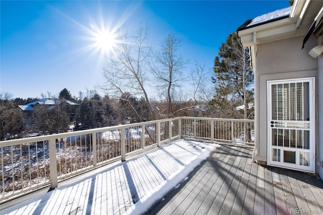 view of snow covered deck