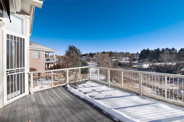 view of snow covered deck