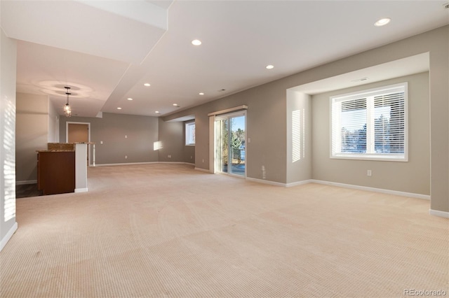 spare room featuring light colored carpet