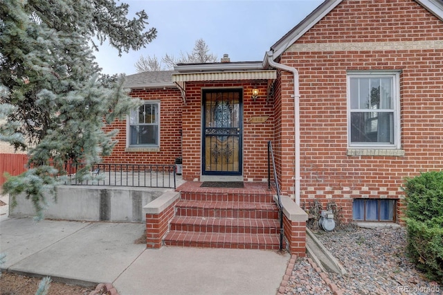 entrance to property with brick siding