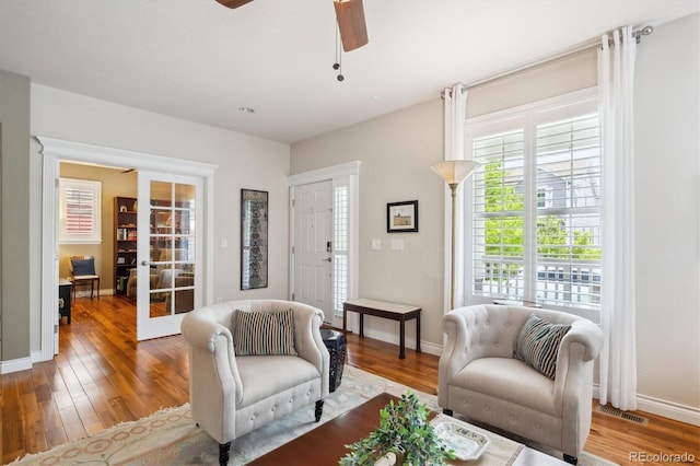 2723 Galena St, Denver, CO 80238 - living area with ceiling fan, wood finished floors, baseboards, and french doors