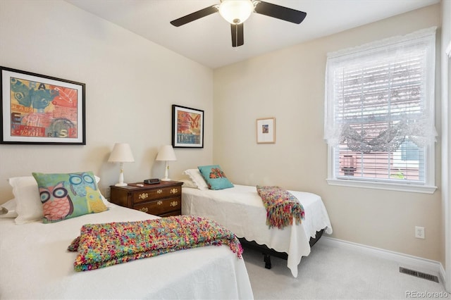 2723 Galena St, Denver, CO 80238 - bedroom with multiple windows, carpet floors, baseboards, and a ceiling fan