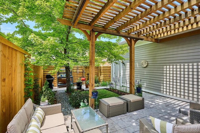 2723 Galena St, Denver, CO 80238 - fenced backyard with outdoor lounge area, a pergola, and a patio area