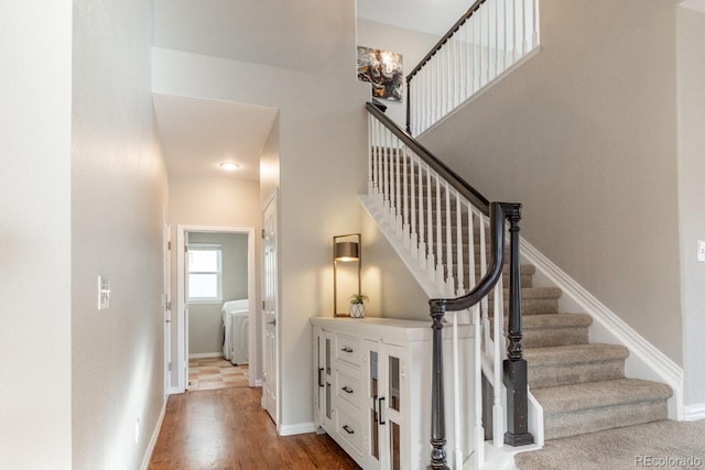 stairway featuring hardwood / wood-style floors