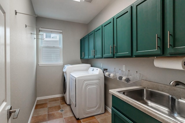 laundry room featuring sink, cabinets, independent washer and dryer, and light tile patterned flooring