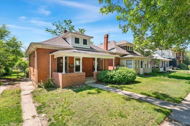 4461 Vrain St, Denver, CO 80212 - bungalow-style home featuring brick siding, a porch, a front yard, a chimney, and a shingled roof