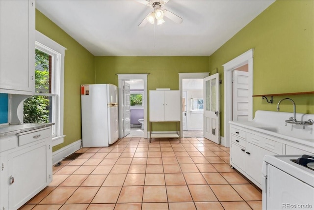 4461 Vrain St, Denver, CO 80212 - kitchen featuring white appliances, healthy amount of natural light, a ceiling fan, and white cabinetry