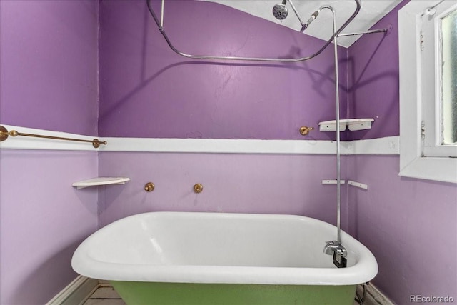 4461 Vrain St, Denver, CO 80212 - bathroom featuring a soaking tub and baseboards
