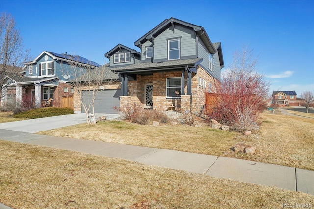 craftsman house featuring a porch, a garage, and a front yard