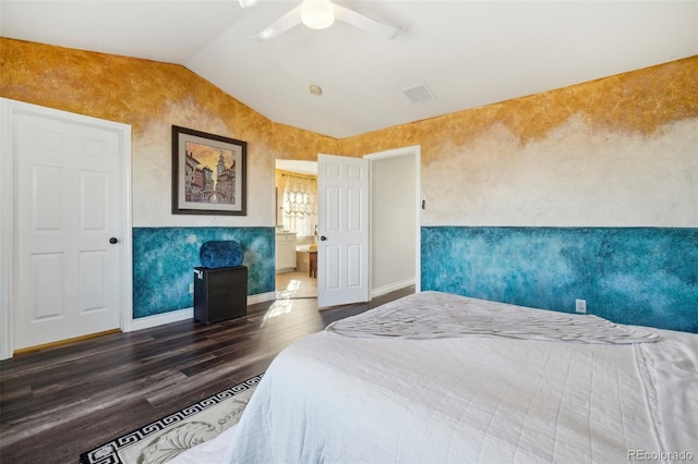 bedroom featuring dark wood-type flooring, ceiling fan, and vaulted ceiling