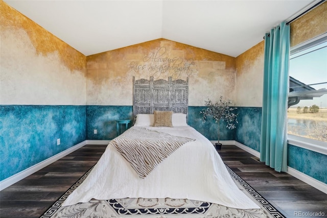 bedroom with multiple windows, vaulted ceiling, and dark wood-type flooring