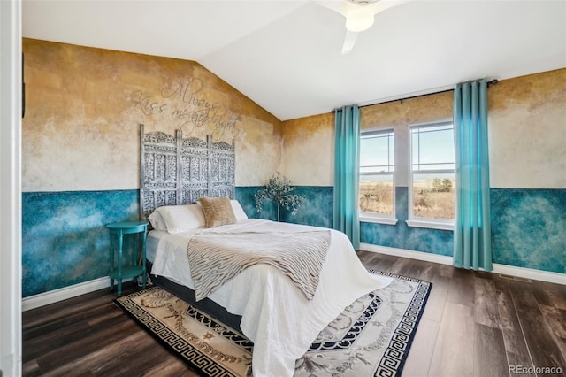 bedroom featuring ceiling fan, vaulted ceiling, and wood-type flooring