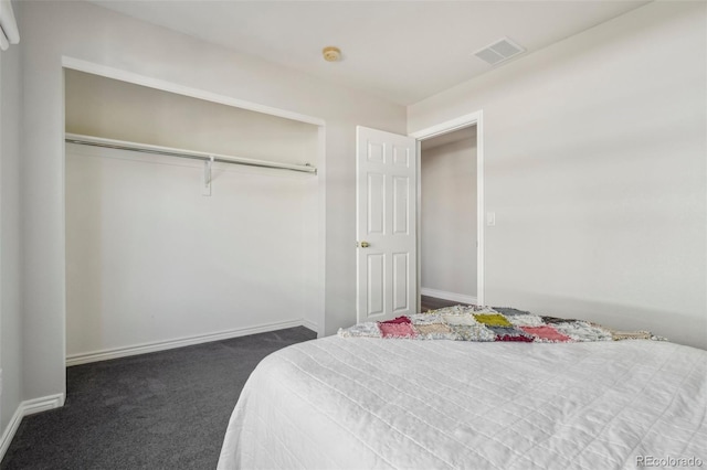 carpeted bedroom with a closet