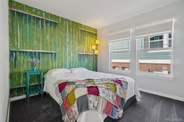 bedroom featuring dark carpet