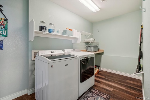 laundry room featuring separate washer and dryer and dark hardwood / wood-style floors