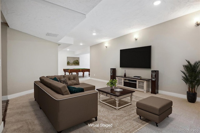 carpeted living room featuring a textured ceiling and billiards