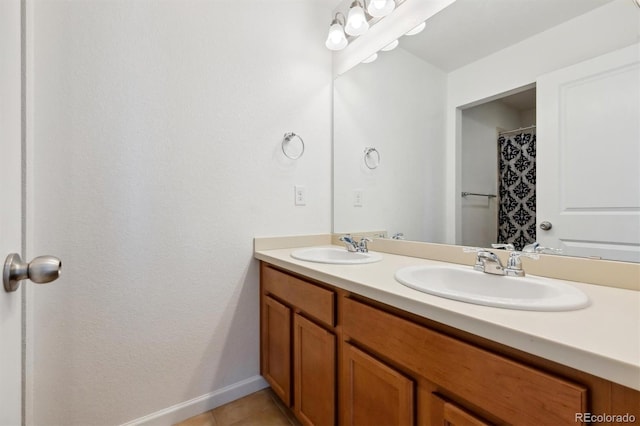 bathroom featuring tile patterned flooring and vanity