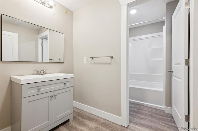 bathroom featuring hardwood / wood-style floors and vanity